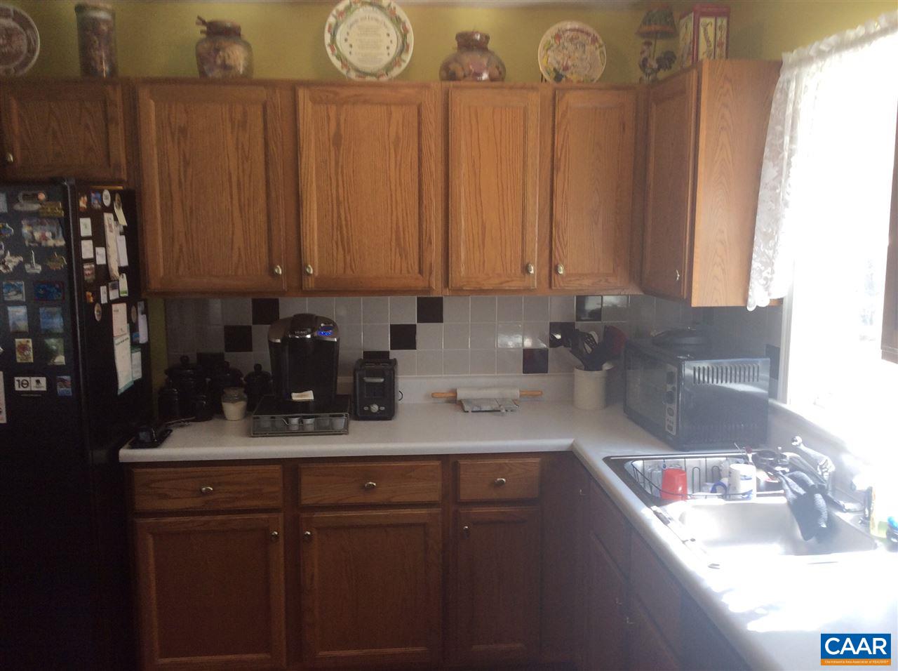 1637 Buckner Road Bumpass, VA 23024 - Photo 4 of 14 a kitchen with sink a refrigerator and cabinets