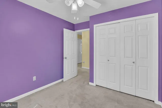 a view of an empty room with a fireplace