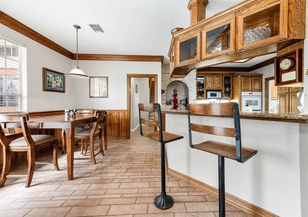 a view of a livingroom with furniture and workspace