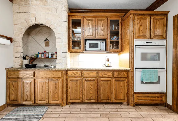 a kitchen with stainless steel appliances granite countertop a stove and a sink