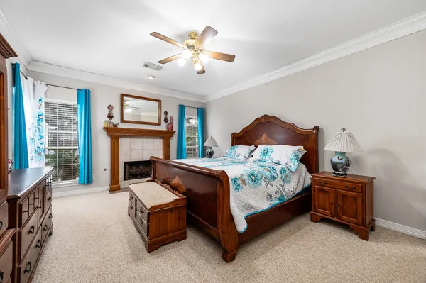 a bed room with a bed and a fireplace