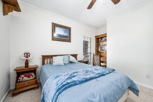 a bedroom with a bed and a cabinets
