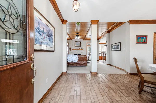 a bedroom with furniture and wooden floor