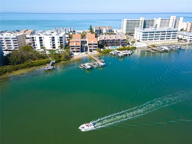 a view of swimming pool with outdoor seating and city view