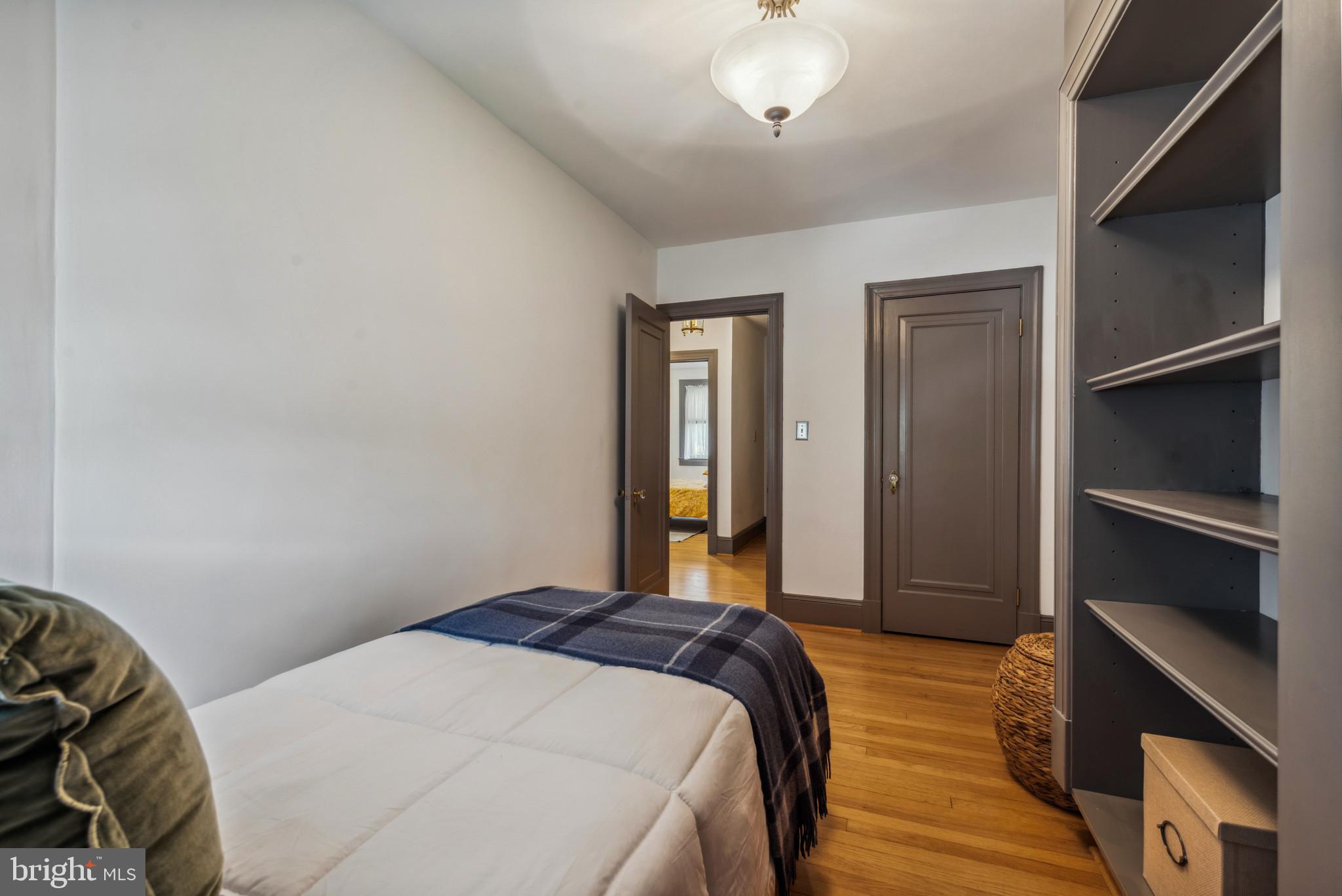 401 Hopkins Road Baltimore, MD 21212 - Photo 23 of 63 a bedroom with a bed and a chandelier