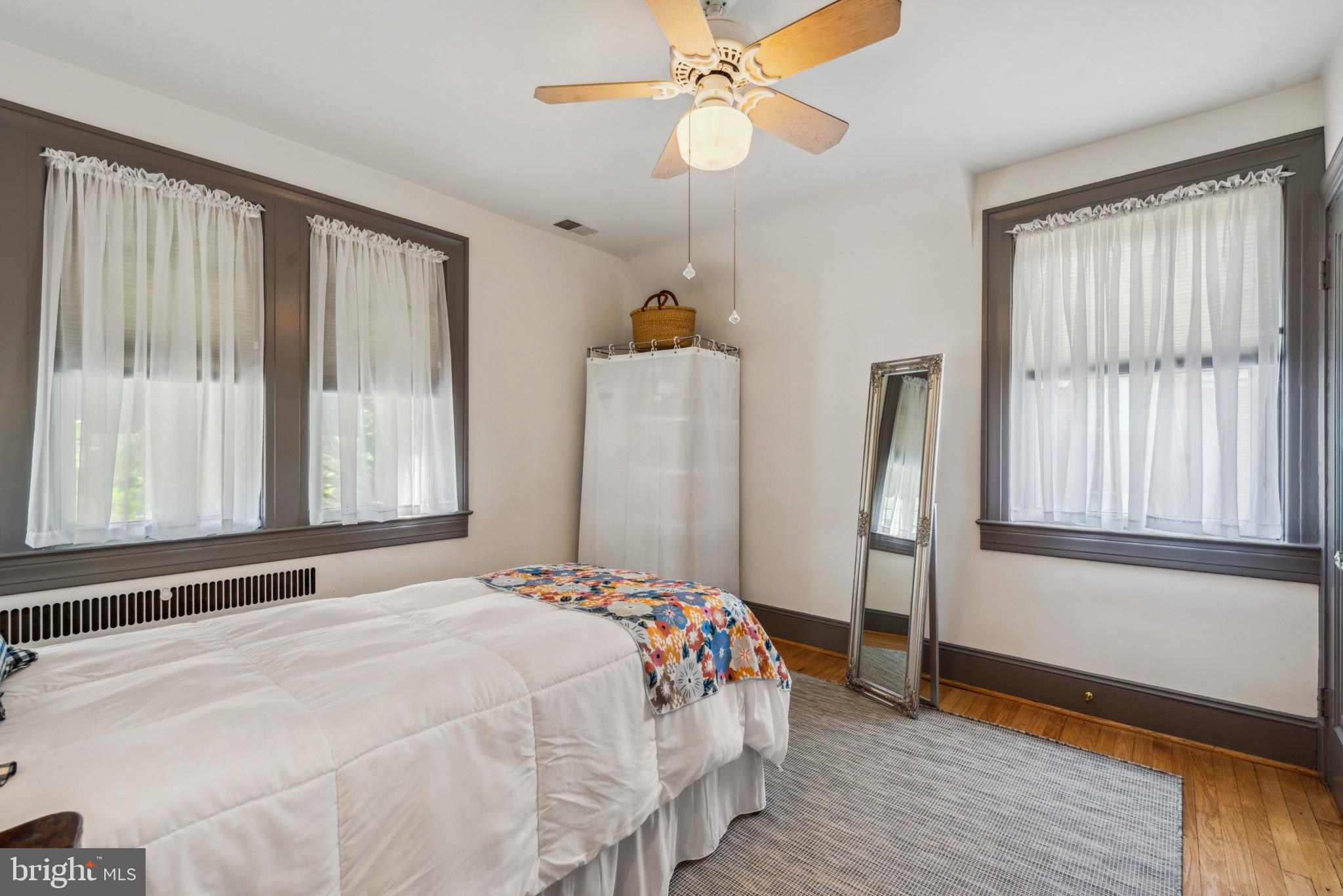 401 Hopkins Road Baltimore, MD 21212 - Photo 25 of 63 Bedroom with radiator heating unit, wood finished