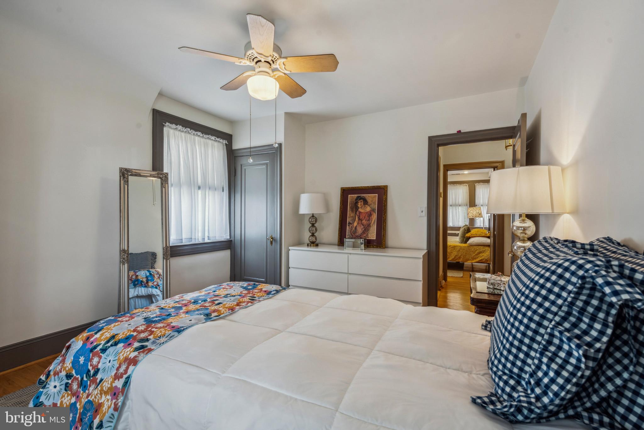 401 Hopkins Road Baltimore, MD 21212 - Photo 28 of 63 a bedroom with a bed and a chandelier