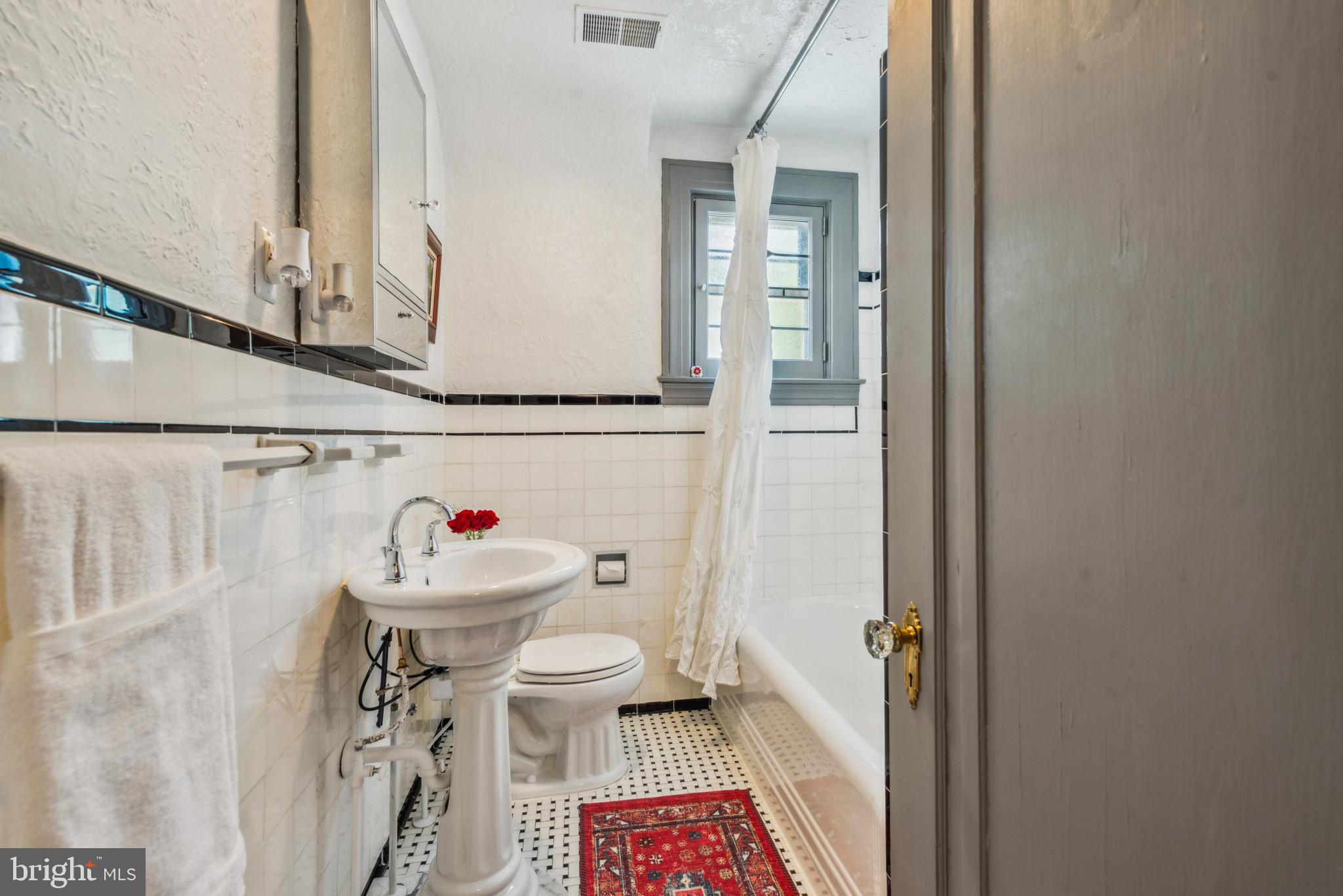 401 Hopkins Road Baltimore, MD 21212 - Photo 37 of 63 a bathroom with a sink toilet and shower