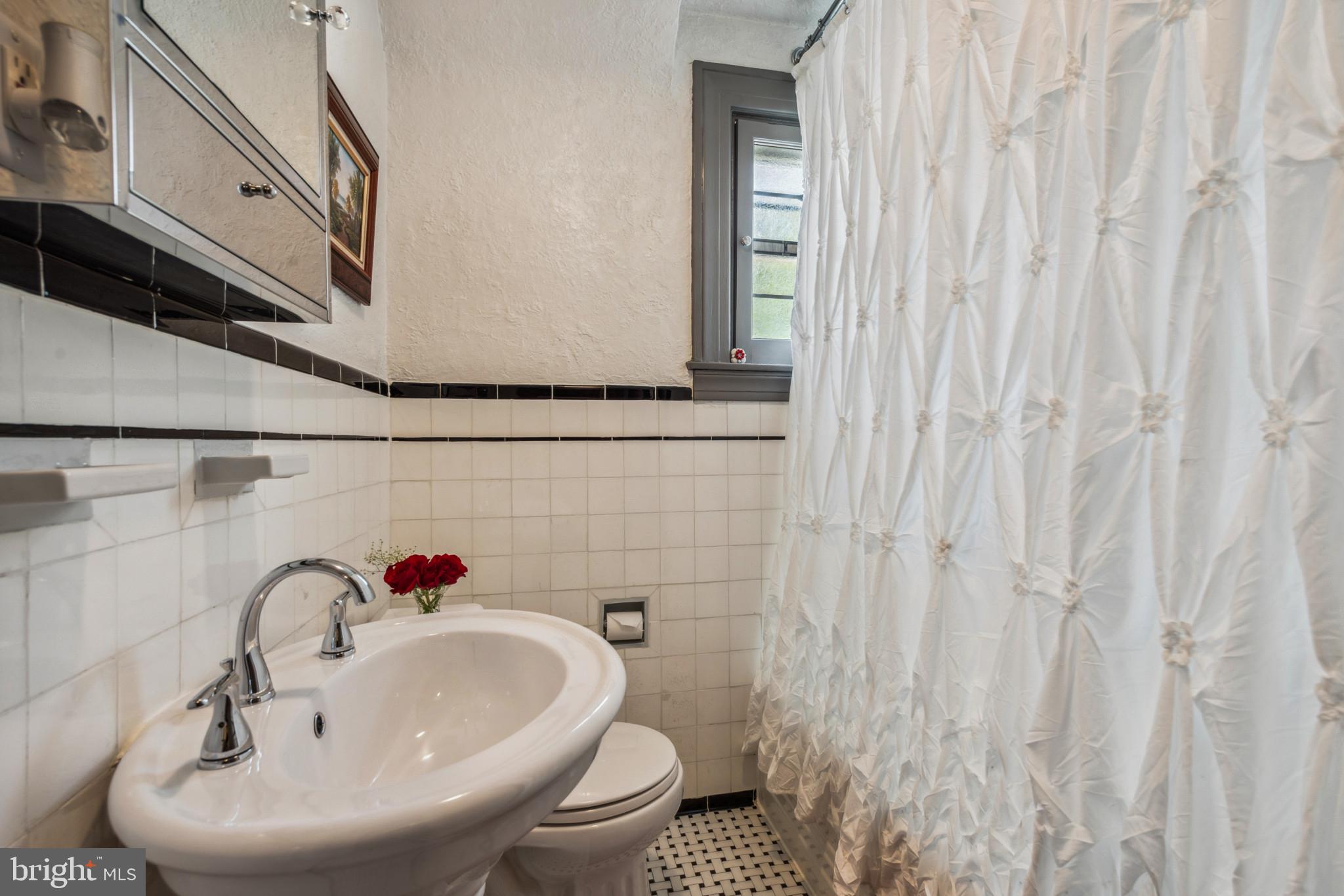 401 Hopkins Road Baltimore, MD 21212 - Photo 38 of 63 a bathroom with a sink and a toilet