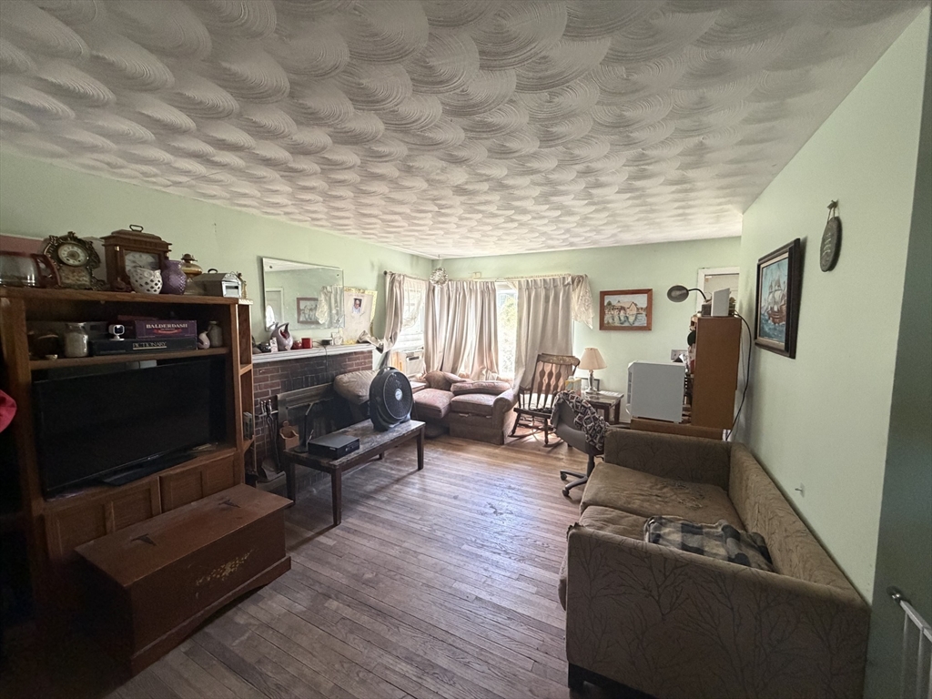 42 Birch Road Westford, MA 01886 - Photo 9 of 10 a living room with furniture and a wooden floor