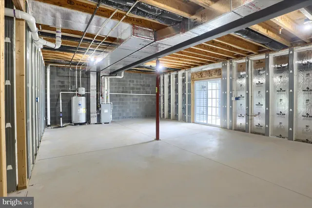 a view of an empty room with wooden walls