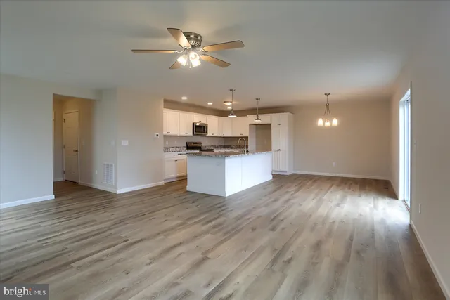 a view of kitchen with wooden floor and window