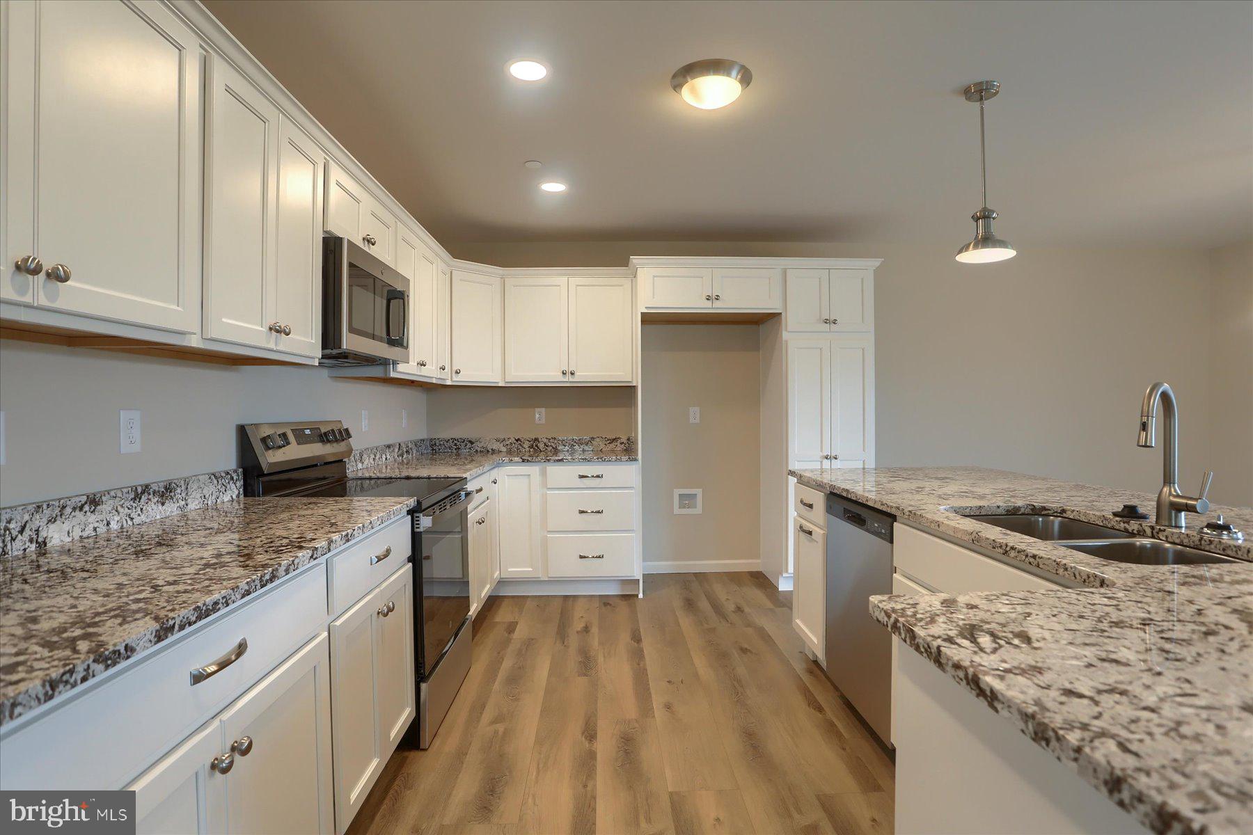 75 Cortland Crossing Palmyra, PA 17078 - Photo 5 of 21 a kitchen with granite countertop a sink a counter space appliances and cabinets
