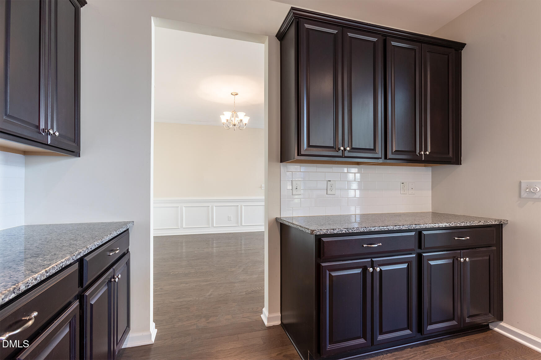 209 Mayfield Drive Apex, NC 27539 - Photo 19 of 48 a kitchen with granite countertop a stove and a microwave