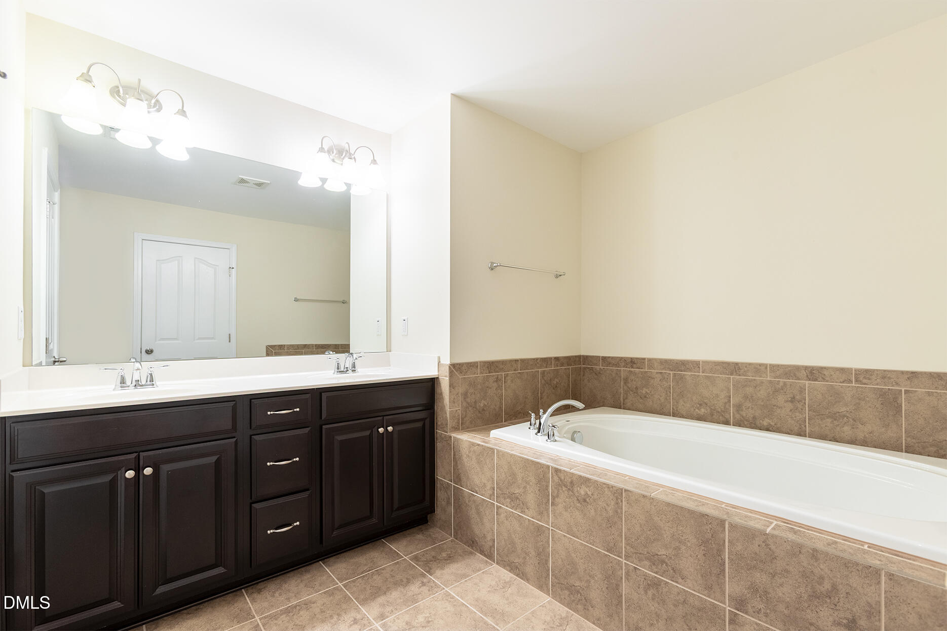 209 Mayfield Drive Apex, NC 27539 - Photo 24 of 48 a spacious bathroom with a tub sink and mirror
