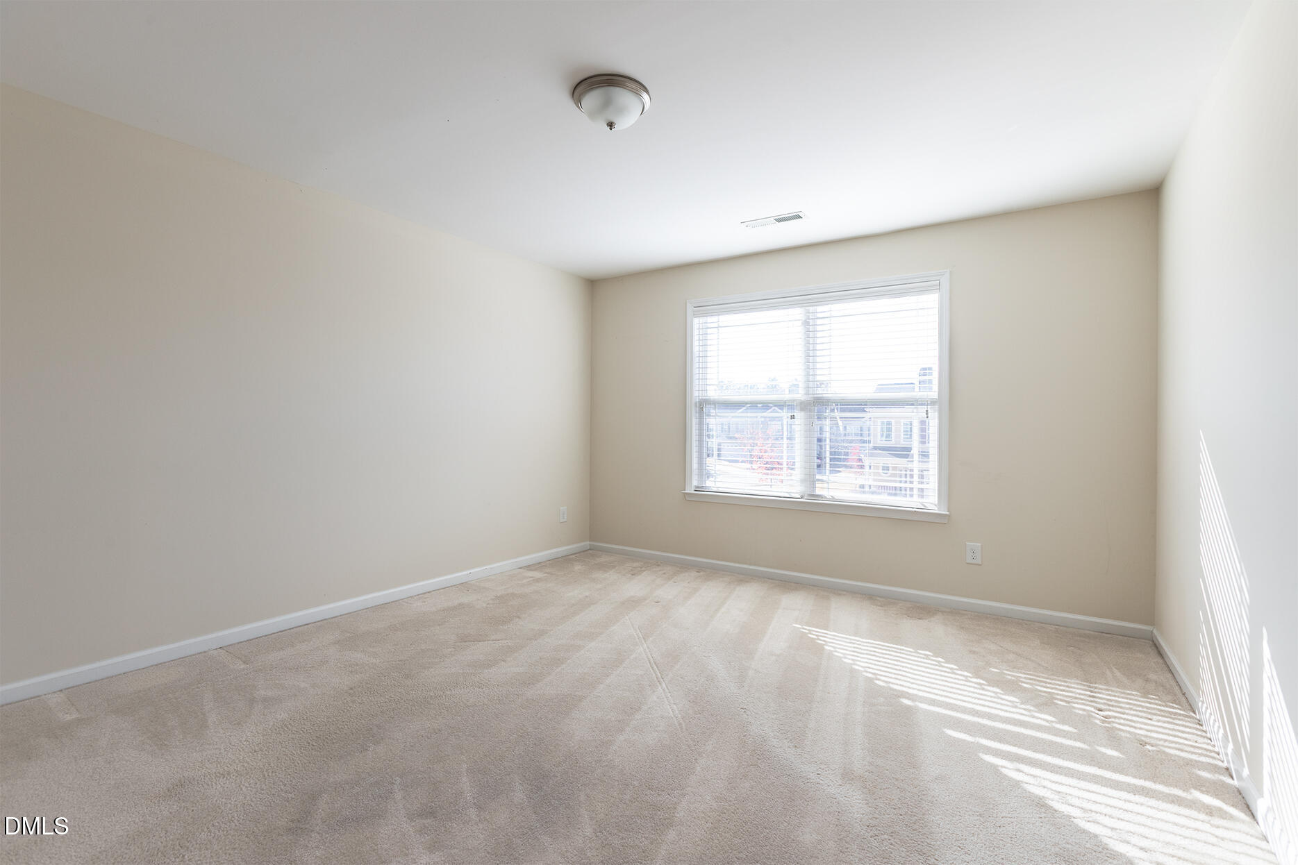 209 Mayfield Drive Apex, NC 27539 - Photo 30 of 48 an empty room with a window