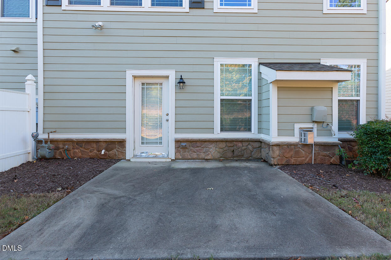209 Mayfield Drive Apex, NC 27539 - Photo 37 of 48 a front view of a house with basket ball court