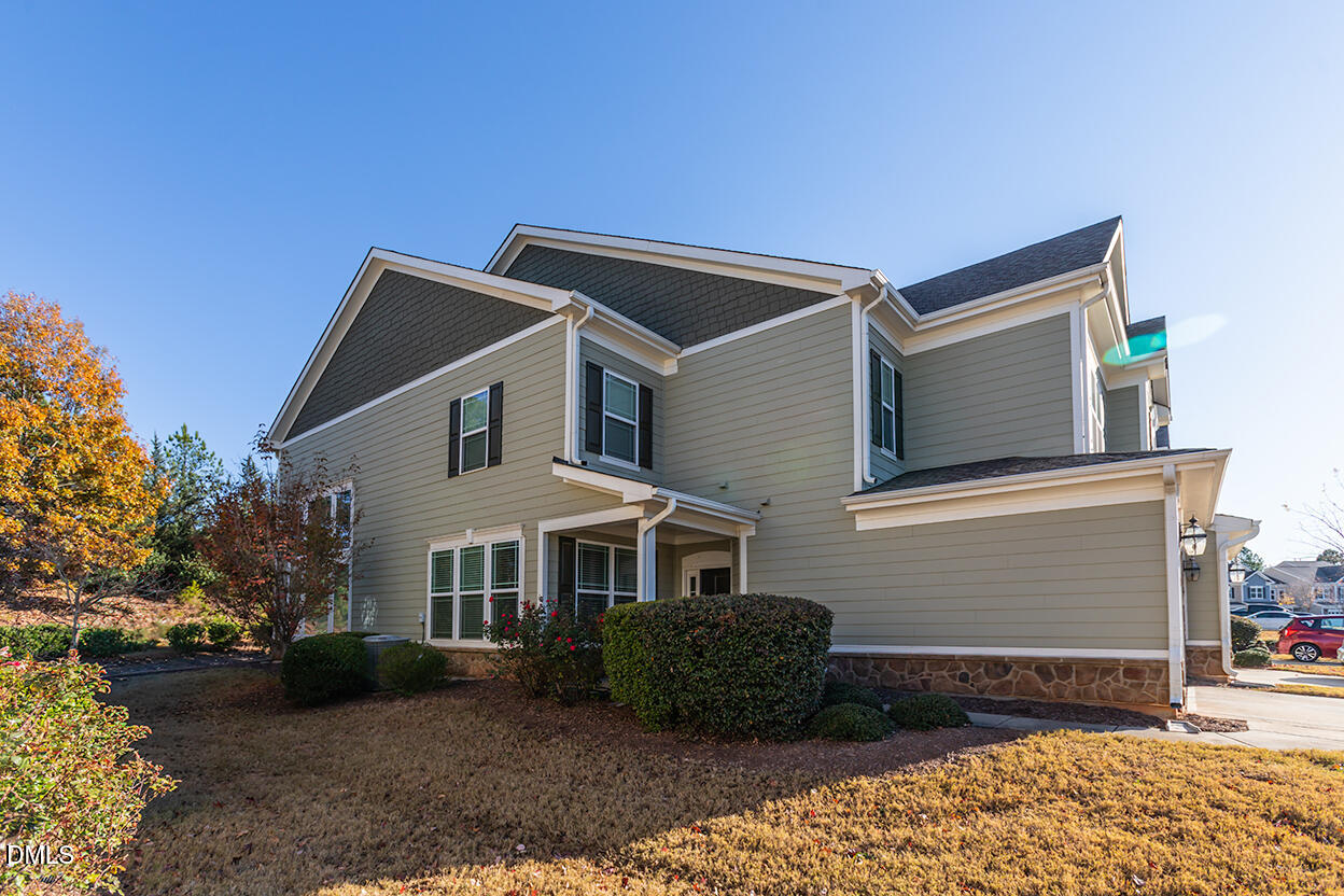 209 Mayfield Drive Apex, NC 27539 - Photo 5 of 48 a front view of a house with garden