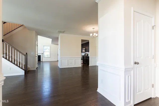 a kitchen with granite countertop wooden cabinets and stainless steel appliances