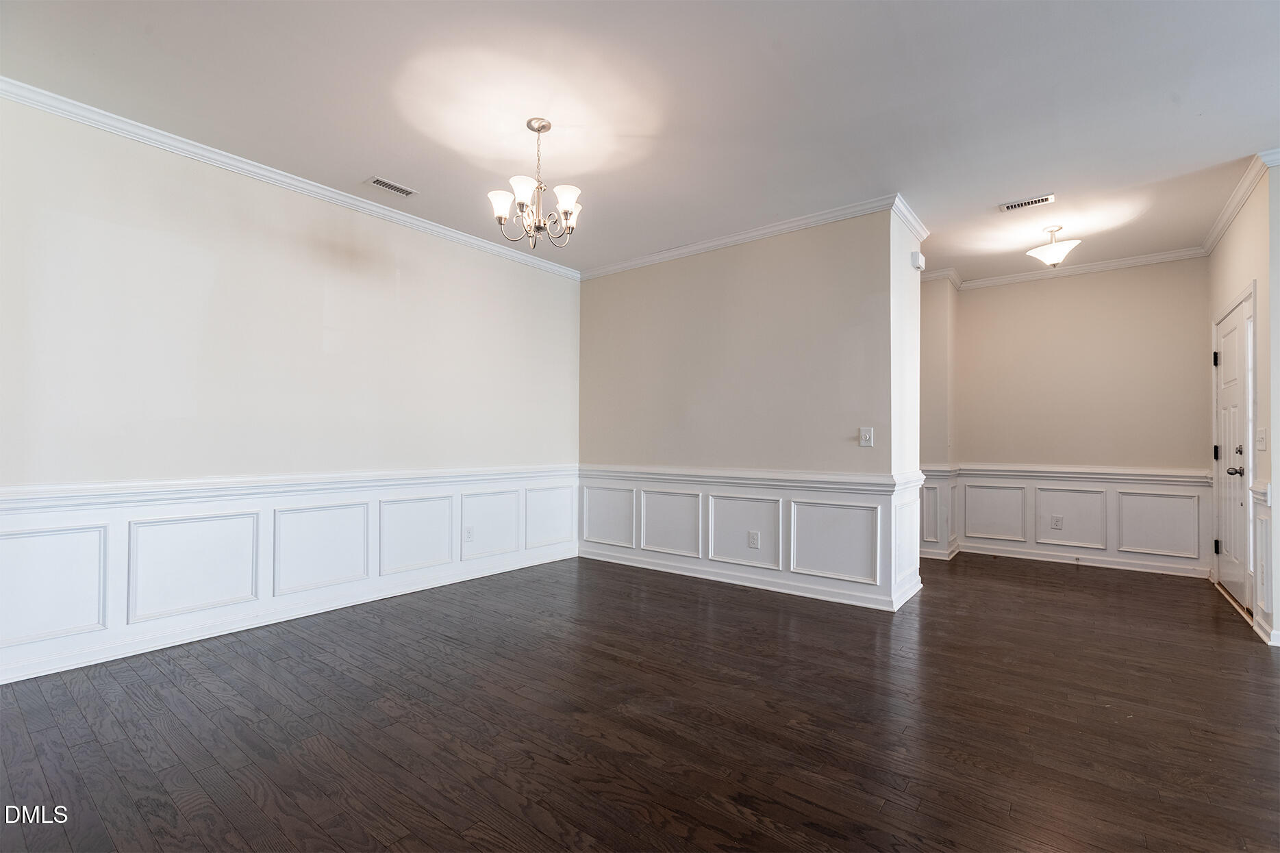 209 Mayfield Drive Apex, NC 27539 - Photo 10 of 48 a view of an empty room with wooden floor