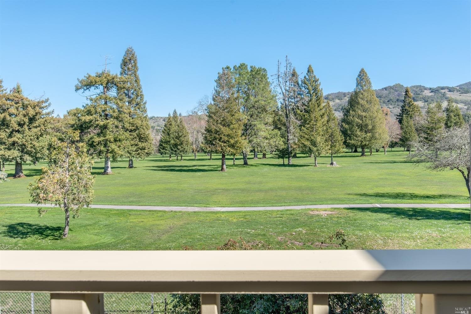 a view of a golf course with a lake