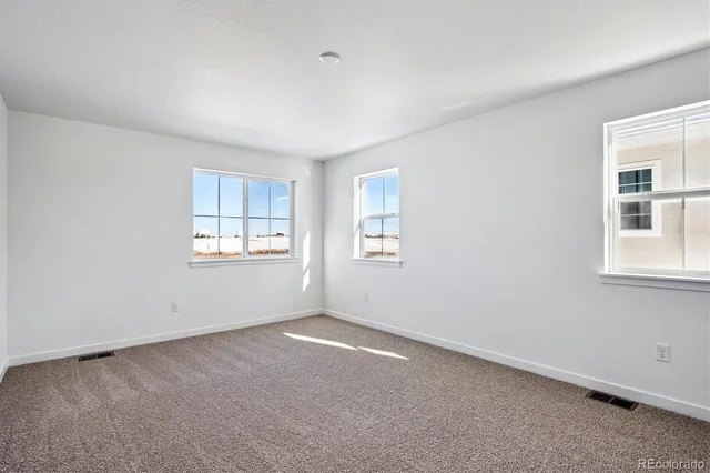 an empty room with windows