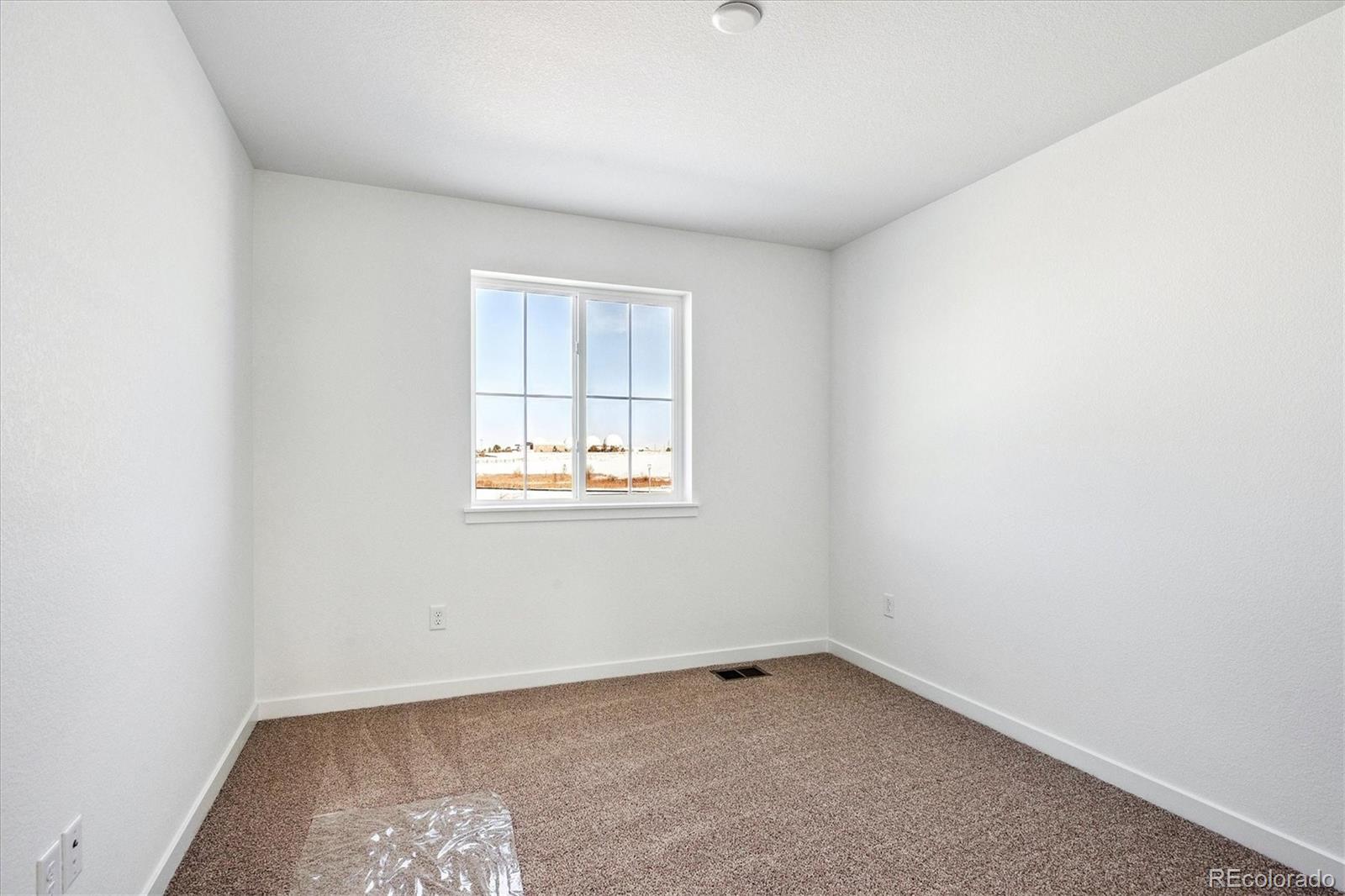 17543 East Virginia Avenue Aurora, CO 80017 - Photo 17 of 26 an empty room with a window