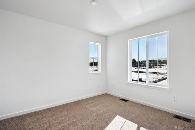 an empty room with windows