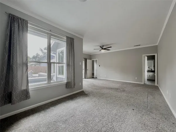 a view of an empty room with a window