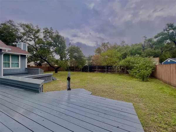 a view of a lake with a yard