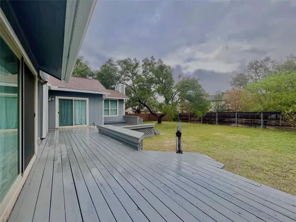 a view of a house with pool and a yard