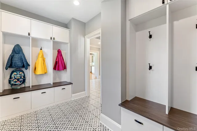 a room with a walk in closet and a bathroom