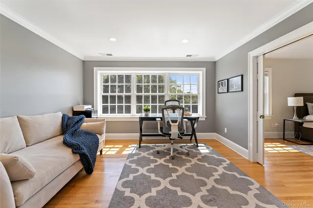 a living room with furniture and a rug