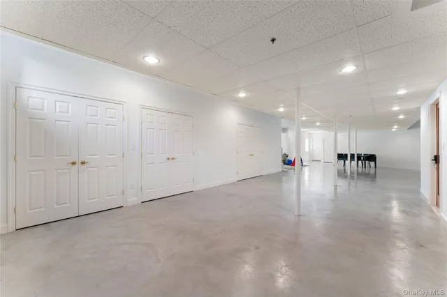 a view of an empty room with a air conditioner vent