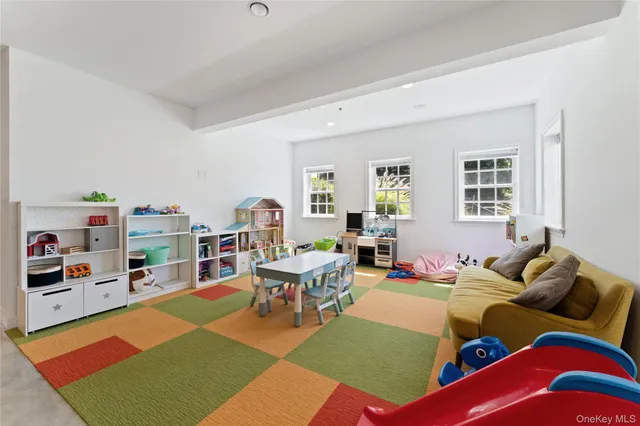a living room with furniture rug and window