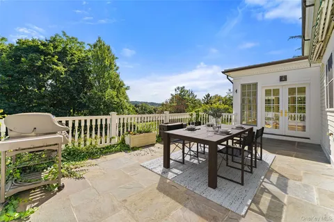 a view of a dinning table and chairs in patio