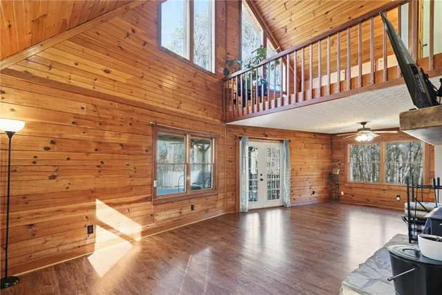 a view of a kitchen with wooden floor and electronic appliances