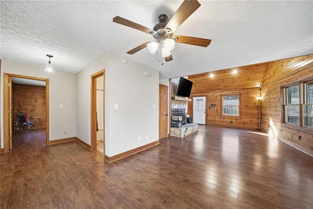 a view of a porch with wooden floor and iron stairs