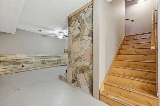 a view of an empty room with a fireplace