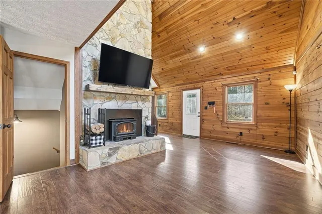 a living room with furniture fireplace and flat screen tv
