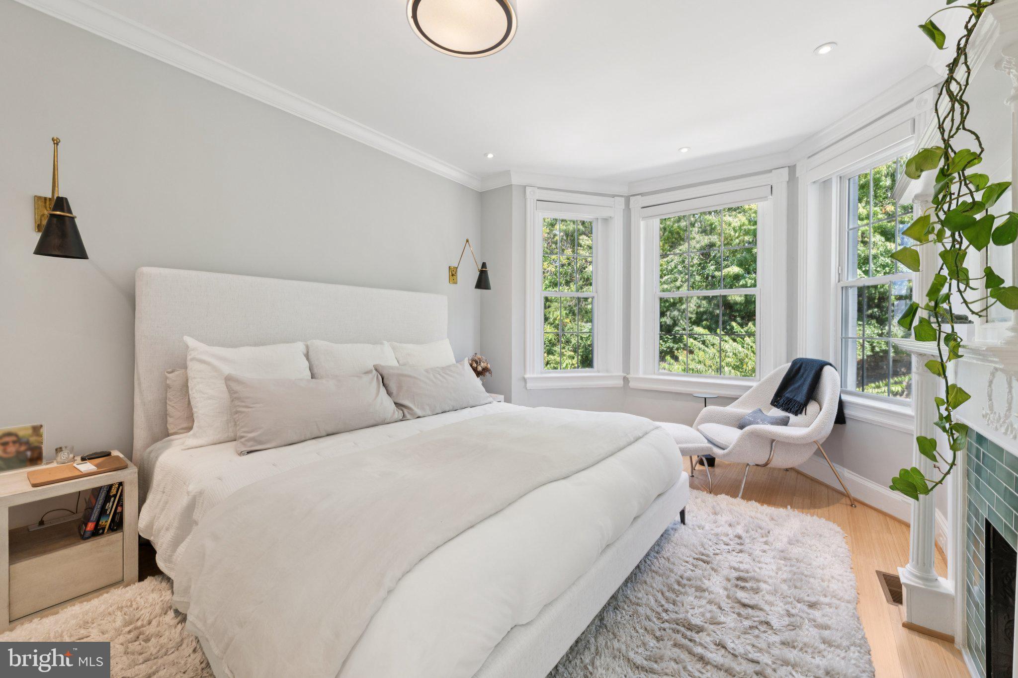 21 V Street Northeast Washington, DC 20002 - Photo 20 of 32 a bed room with a bed and a chair