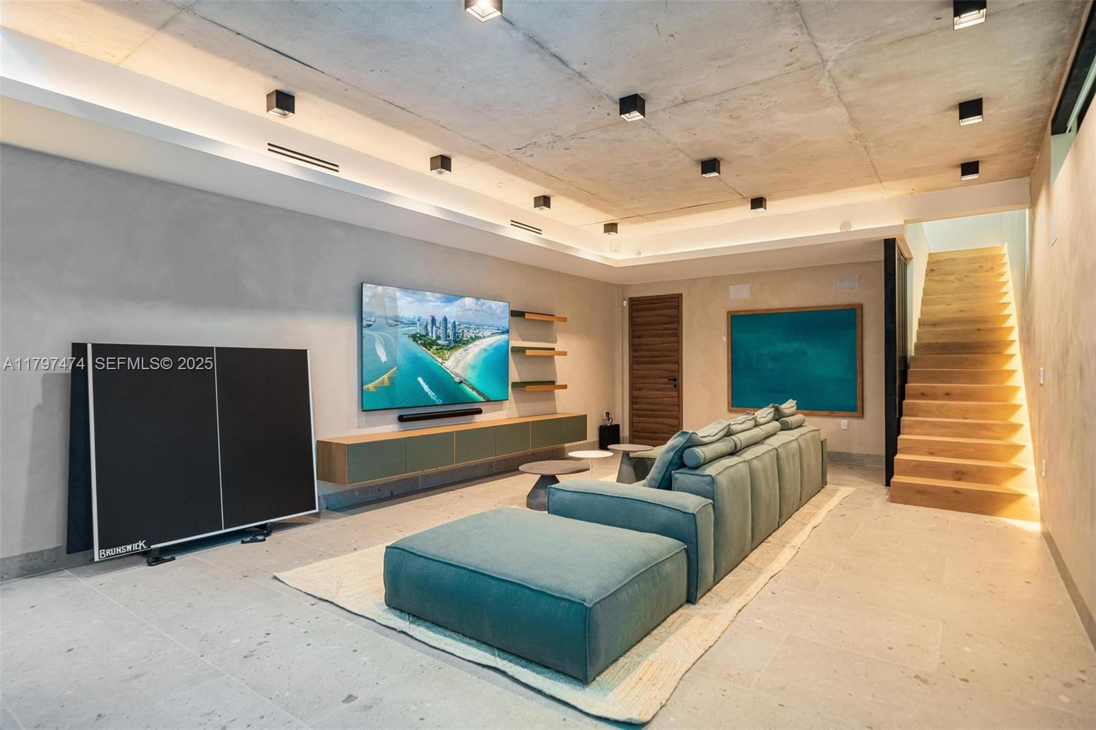 3101 Jefferson Street Miami, FL 33133 - Photo 13 of 17 a living room with furniture and a flat screen tv