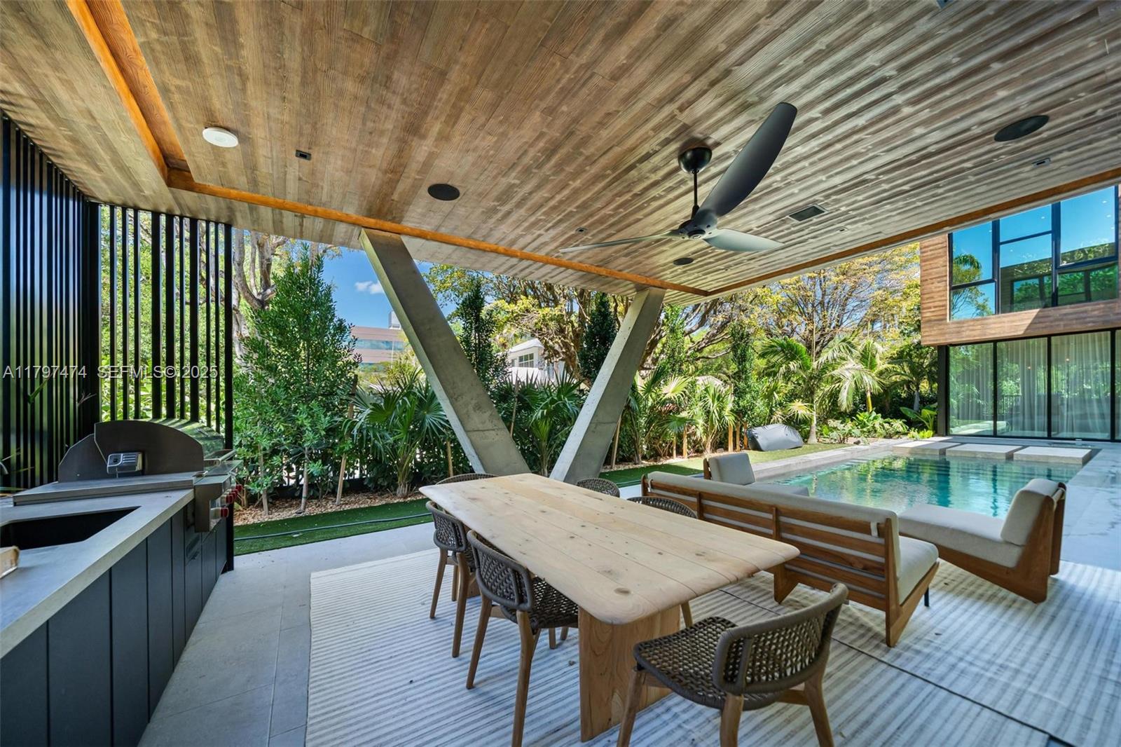 3101 Jefferson Street Miami, FL 33133 - Photo 3 of 17 a view of a patio with a table chairs and a grill