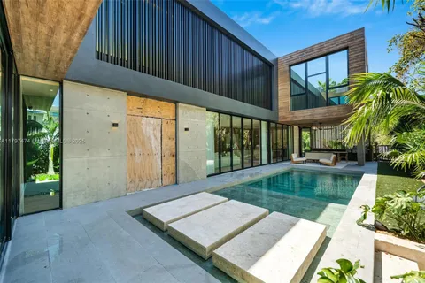 a view of a swimming pool with a patio