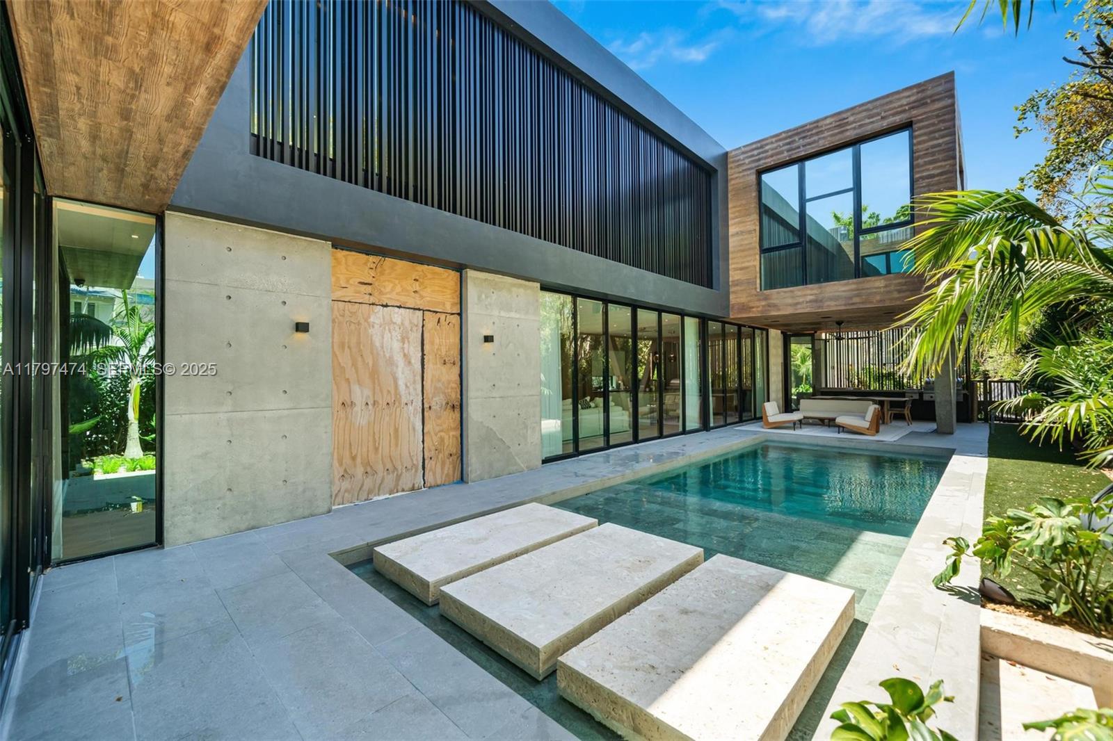 3101 Jefferson Street Miami, FL 33133 - Photo 5 of 17 a view of a swimming pool with a patio