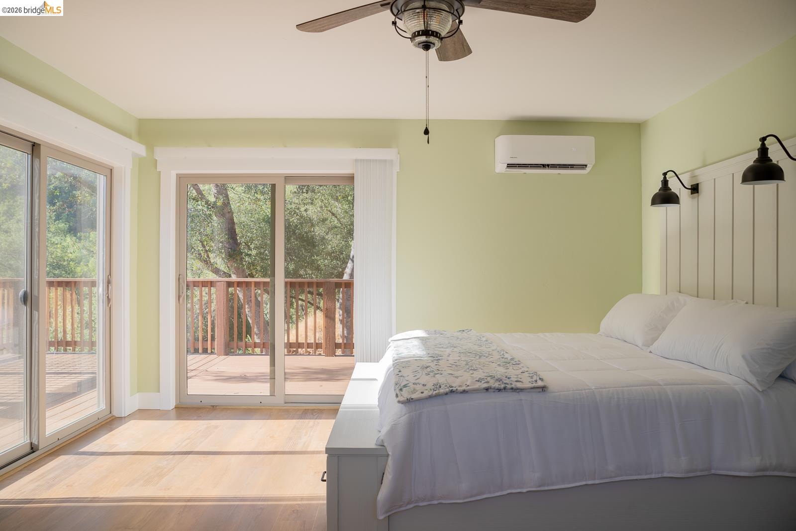 18399 Lime Kiln Road Sonora, CA 95370 - Photo 14 of 36 Room featuring two sets of sliding glass doors opening to a wooden deck
