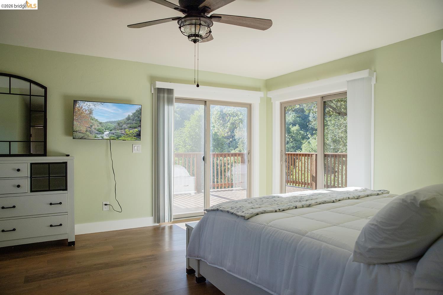 18399 Lime Kiln Road Sonora, CA 95370 - Photo 15 of 36 Bedroom featuring wood-finish flooring and a ceiling fan with integrated lighting