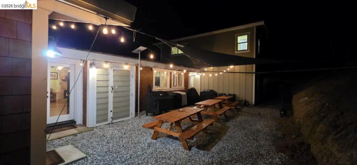 18399 Lime Kiln Road Sonora, CA 95370 - Photo 30 of 36 Expansive outdoor area featuring a gravel surface, string lighting, and a shade sail