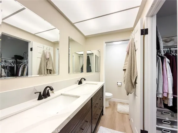 a kitchen with a stove sink and cabinets