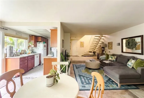a view of a livingroom with furniture and a window